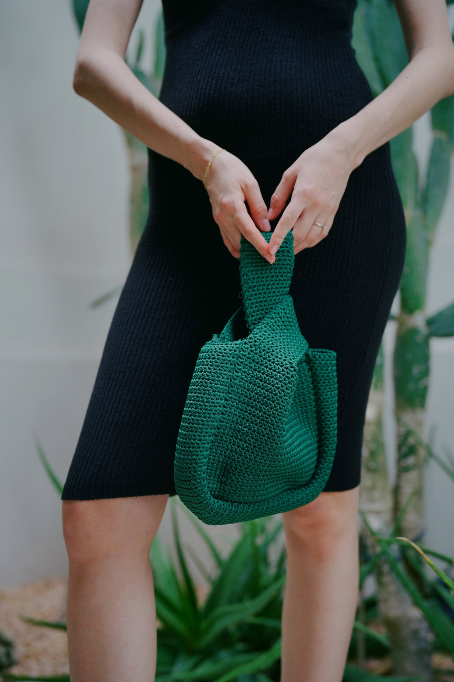 Mackenzie Strick-Clutch in Smaragdgrün