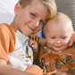 Organic Cotton Two-Piece Short Pajama Set Sloths On Tan And Mottled Background