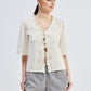 Relaxed Fit Top With Ruffles and Front-Ties in Cream