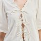 Relaxed Fit Top With Ruffles and Front-Ties in Cream